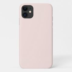 a pink iphone case sitting on top of a white surface