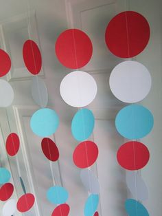 an instagram page with red, white and blue paper circles hanging from the ceiling