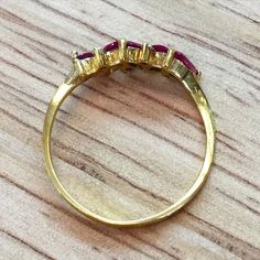 Metal: 14kt Yellow Gold Stone: Ruby and Diamond Ruby Weight: Approx. .55 Carats Diamond Weight: N/A Weight of entire piece: 1.50 Grams Ring Size: 7 Sizable: Yes. Please state in size/personalization box. Age: Vintage Condition: Excellent Classic Marquise Ruby Ring With Vvs Clarity, Pear-shaped Brilliant Cut Yellow Gold Ruby Ring, Gold Marquise Ruby Ring With Diamonds, Luxury Yellow Gold Ruby Ring With Marquise Cut, Luxury Yellow Gold Marquise Cut Ruby Ring, Classic Gold Marquise Emerald Ring, Luxury Marquise Cut Yellow Gold Ruby Ring, Luxury Marquise Cut Ruby Ring In Yellow Gold, Classic Marquise Emerald Ring In Gold