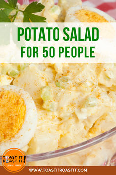 potato salad with hard boiled eggs and parsley on top in a glass bowl text overlay reads potato salad for 50 people