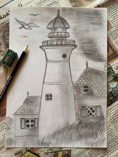 a pencil drawing of a lighthouse on top of a piece of paper with some pictures around it