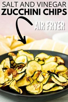 a black bowl filled with sliced zucchini chips