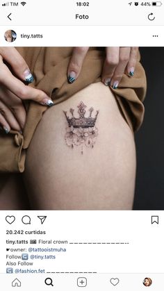 a woman's stomach with a crown tattoo on her belly and the words instagram written