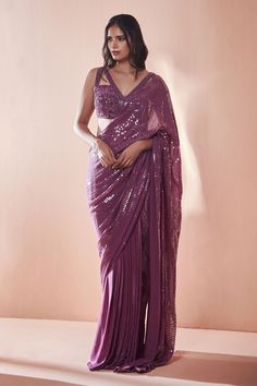 Purple embroidered pre-draped saree in sequin work. Paired with cutdana embroidered blouse.
Component: 2
Pattern: Hand embroidered
Type Of Work: Sequins, Cutdana work
Neckline: V neck
Sleeve Type: Sleeveless
Fabric: Silk crepe, Georgette
Color: Purple
Other Details: 
Cut work blouse
Occasion: Wedding, Reception - Aza Fashions Fancy Sarees Wedding Reception, Net Saree Designs, Cocktail Saree, Cut Work Blouse, Simple Saree Designs, Saree Draping Styles, Trendy Outfits Indian, Fancy Sarees Party Wear, Drape Saree