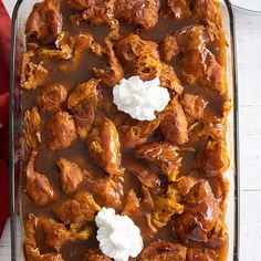 a casserole dish filled with chicken covered in gravy and sour cream