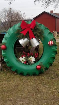 a christmas wreath with bells and ornaments in the shape of a tire