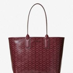 Brand New 100% Authentic Michael Kors Jodie Large Shoulder Tote Coated Jacquard Merlot A Classic Tote With A Modern Twist, Our Jodie Bag Is An Everyday Essential. Crafted From Recycled Jacquard That’s Woven With Our Initials, This Sizable Carryall Is Perfect For Carrying Everything You Need For A Busy Day Or Weekendfrom A Tablet To An Extra Set Of Clothes. Details Tote Bag Logo Jacquard 100% Recycled Polyester Merlot-Tone Hardware 17.75”W X 12”H X 6.75”D Handle Drop: 8.5” Lining: 60% Polyurethan Formal Bags With Monogram Print, Clothes Details, Jodie Bag, Merlot Color, Bag Logo, Mk Purse, Michael Kors Shoulder Bag, Busy Day, Genuine Leather Bags