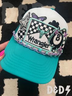 This custom made trucker patch hat is perfect for any occasion whether it be for spring/summer time, a lake hat, a gift for someone, or just a cute accessory to add a little spice to your outfit 🧢✨ DETAILS-  * This hat is one size with an adjustable SnapBack that is adjustable from 20in. - 23.5in. * The color of this hat is Turquoise & Purple * The material of the hat is polyester with iron on patches  REFUNDS AND CANCELLATIONS- Every hat is handmade by me as a result, a slight variation can occur from the picture with patch size or placement. If you have any problems with your hat please message me within 24 hours of receiving your order and I'd be happy to help! No refunds or exchanges will be accepted after. CONNECT- To enter giveaways, discount codes, or behind the scenes, follow our Vintage Summer Trucker Hat With Visor, Trendy Adjustable Hat With Embroidered Patch, Retro Summer Trucker Hat With Visor, Trendy Trucker Hat With Patches, Fun Adjustable Hats With Patches, Blue Snapback Hat For Rodeo, Trendy Trucker Hat For Rodeo, Retro Visor Trucker Hat For Summer, Fun Adjustable Hat With Patches