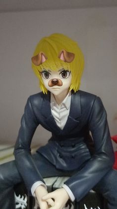 a figurine that is sitting on top of a table