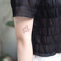 a person with a small tattoo on their arm