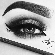 an eyeliner and pencil on top of a white surface