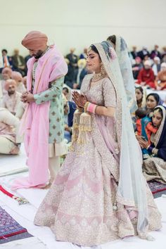 the bride and groom are getting ready to walk down the aisle at their wedding ceremony