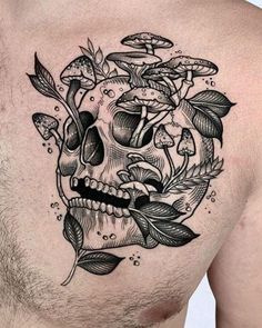 a man with a skull and flowers tattoo on his chest