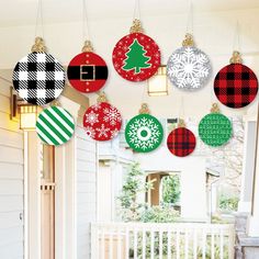 christmas ornaments hanging from the ceiling in a room