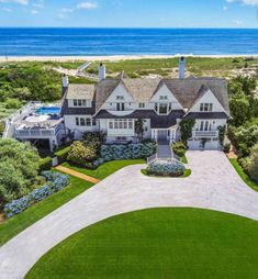 this is an aerial view of the house and its driveway, which overlooks the ocean