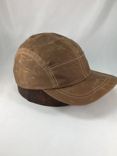 "COLOR SHOWN is Brown waxed cotton. Nothing gets the heart pumping like watching Quint fearlessly battle the massive great white shark off the coast of Cape Cod . Now you can harness the look with this waxed cotton cap. Meticulously handcrafted with quality materials and construction which results in a cap that will last for years! Hand crafted to order in absolutely any size. This water resistant material will age gracefully when handled. The cracking and wear marks of waxed cottons nature will Pre-washed Cotton 5-panel Hat, Vintage Cotton Snapback Hat For Outdoor, Vintage Canvas Baseball Cap With Curved Brim, Vintage Trucker Hat For Outdoor Activities, Cotton Flat Cap For Outdoor, Cotton Flat Cap For Outdoor Use, Vintage Cotton 5-panel Snapback Hat, Vintage Canvas Cap, Pre-washed 5-panel Cotton Hat