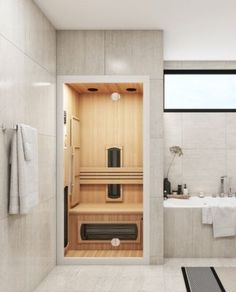 a bathroom with a tub, sink, and window in the wall next to it