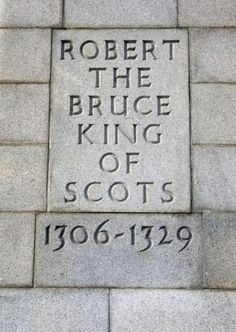 the inscription on the side of a brick wall that reads robert the bruce king of scots