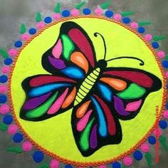 a colorful butterfly painted on top of a yellow circle