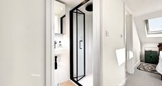 an open door leading to a bathroom and bedroom