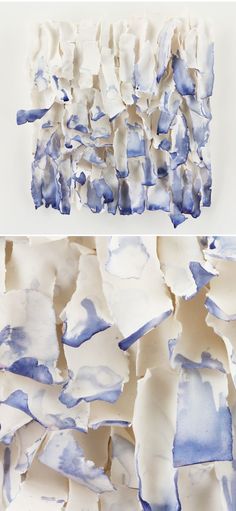 blue and white paint is being used to create an abstract painting