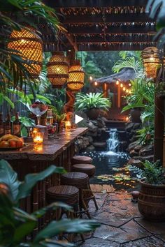 an outdoor dining area with candles and plants