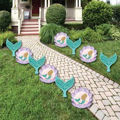 mermaid party decorations in front of a house