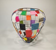 a vase made out of multiple colored squares