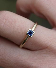 Small 3mm square dark blue sapphire is set in an 18ct gold  ring. This ring can be stacked with others and is also available with an emerald and a ruby or a diamond (extra cost).The band is 1.5mm round, so overall a delicate but solid ring. Made to order in your size. Orders take 3-4 weeks. Sapphires are the birthstone for Septemebr babies.For other stacking rings go to:www.etsy.com/shop/karenjohnsondesignor facebook.com/karenjohnsondesign Rectangular Sapphire Anniversary Ring, Square Cut Sapphire Ring For Gift, Square Cut Sapphire Ring As Gift, Modern Sapphire Ring Birthstone, Sapphire Princess Cut Ring For Gifts, Rectangular Sapphire Ring In Yellow Gold, Modern Rectangular Blue Sapphire Ring, Modern Blue Rectangular Sapphire Ring, Modern 14k Gold Rectangular Sapphire Ring