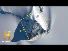 an aerial view of a snow covered mountain with a yellow square in the middle that says history