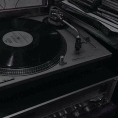 a turntable sitting on top of a record player