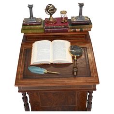 an open book sitting on top of a wooden desk