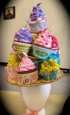 there are many cupcakes on top of the hat