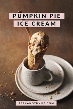 a cup filled with ice cream sitting on top of a plate