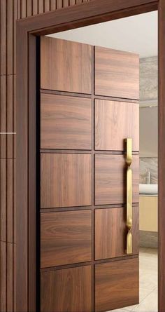 an open door with wooden paneling and brass handles in a room that has tile flooring