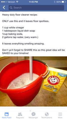 a red bucket filled with liquid sitting on top of a counter