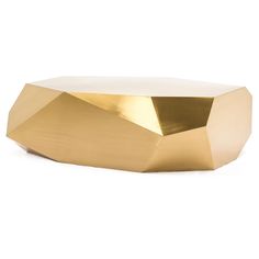 a gold metal object on a white background