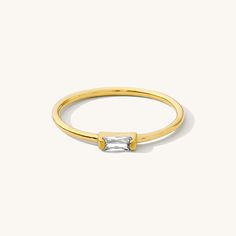 The Dainty Baguette Ring is effortlessly elegant, yet dainty enough to wear every day. You can dress it up or down; whether it’s a stroll in the sand or an evening in the city, this sweet ring is sure to make you feel gorgeous. DETAILS 14k gold vermeil -or- sterling silver ring 1mm band with cubic zirconia stone Sizes 5-8 available Safe for sensitive skin & shower safe Matching necklace: Dainty Baguette Necklace Bundle & Save up to 25% if you're buying multiple rings Baguette Necklace, Multiple Rings, Sweet Ring, Baguette Ring, Dainty Bracelets, Stud Earrings Set, Rings Simple, Ring Size Guide, Favorite Rings