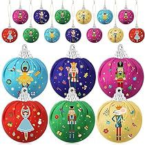 a bunch of colorful christmas ornaments hanging from the side of a white wall with an image of nutcrackers on them