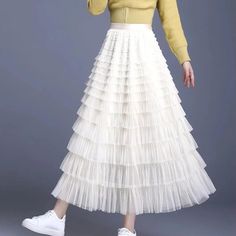 Discover the Charm of Elegance Step into a world of grace and style with our Elegant Spring/Summer Tulle Skirt. Designed for the modern woman who appreciates a blend of casual sophistication and timeless elegance, this skirt is perfect for a variety of occasions. Whether you're attending a casual gathering or dressing up for a more formal event, this skirt will elevate your wardrobe with its chic and versatile design. Product Features Material: High-quality polyester and voile blend for durability and a soft feel Style: Casual yet chic, with a solid pattern that pairs easily with any top Elasticity: Slight stretch to fit your body comfortably Season: Ideal for spring and summer wear Waistline: Empire cut to accentuate your figure Fit Type: Regular fit ensuring freedom of movement Silhouett Elegant Non-stretch Tiered Skirt, Elegant Non-stretch Tulle Skirt, Chic Non-stretch Tulle Skirt, Chic White Non-stretch Skirt, Elegant Non-stretch Maxi Skirt For Spring, Spring Long Tulle Skirt Bottoms, Spring Flowy Tulle Bottoms, Elegant Non-stretch Maxi Skirt For Summer, Non-stretch Tulle Maxi Skirt