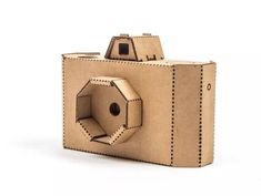 a camera made out of cardboard on a white background