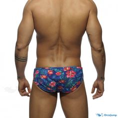 Orcajump - Stylish Swim Shorts with Floral Print and Adjustable Cups for Enhanced Coverage and Confidence Blue Tropical Stretch Bottoms, Stretch Tropical Blue Bottoms, Fitted Multicolor Tropical Bottoms, Fitted Tropical Multicolor Bottoms, Red Flowers, Swim Shorts, Green Leaves, Floral Print, Floral Prints