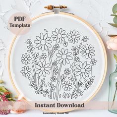 an embroidery pattern with flowers on it and the words instant printable in front of it