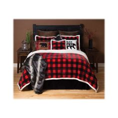 a bed with red and black plaid comforter on it in a brown room next to a window