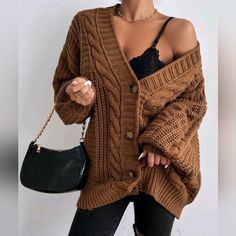 Oversized Boho Chunky Cable Knit Cardigan Sweater * Long Lantern Sleeve * Ribbed Knit Trim * V Neckline * Button Front * Soft Stretch * Relaxed Oversized Fit * Short Length *Approximate Unstretched Measurements* Xs (2) * Length 26.25" * Bust 45.5" * Sleeve Length 18.5" Small (4) * Length 26.75" * Bust 47.25" * Sleeve Length 19" Medium (6) * Length 27.25" * Bust 48.75" * Sleeve Length 19" Large (8/10) * Length 27.75" * Bust 51.25" * Sleeve Length 19.25" Xl (12) * Length 28.25" * Bust 53.5" * Slee Lantern Sleeve Cardigan, Retro Style Fashion, Chunky Cable Knit Cardigan, Winter Car, Cardigan Knitted, Retro Fashion Women, Cable Knit Sweater Cardigan, Populaire Outfits, Loose Knit Sweaters