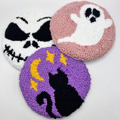 three halloween coasters with different designs on them