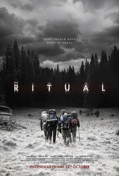 a movie poster for ritual with three people walking through the grass in front of dark clouds