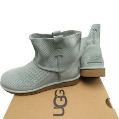 Ugg Women's Classic Unlined Mini Perf Boot Size: 5 Model: 1016852 Color: Aloe Vera Our Beloved Classic Mini Is Keeping It Breezy In Perforated Suede. As Durable As Ever, It’s Finished With Our Innovative Treadlite By Ugg Sole For Unmatchable (Lightweight!) Traction On Any Surface. Suede Cotton Lining In Vamp Leather Insole Treadlite By Ugg Outsole 5" Shaft Height Size: 5 Us / 3.5 Uk / 36 Eu / 22 Japan Brand New With Box (Has No Lid) 100% Authentic Casual Ankle-high Boots With Perforations, Casual Boots With Perforated Round Toe, Casual Boots With Perforated Toe Box, Casual Leather Boots With Perforated Toe Box, Casual Leather Boots With Perforations, Ugg Classic Mini Boot, Moccasin Ankle Boots, Ugg Classic Mini Ii, Ugg Booties