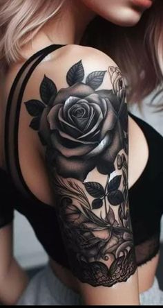 a woman's arm with a rose tattoo on the back of her left shoulder