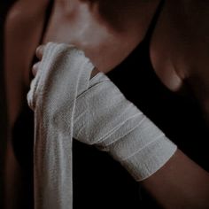 a woman with bandages on her arm